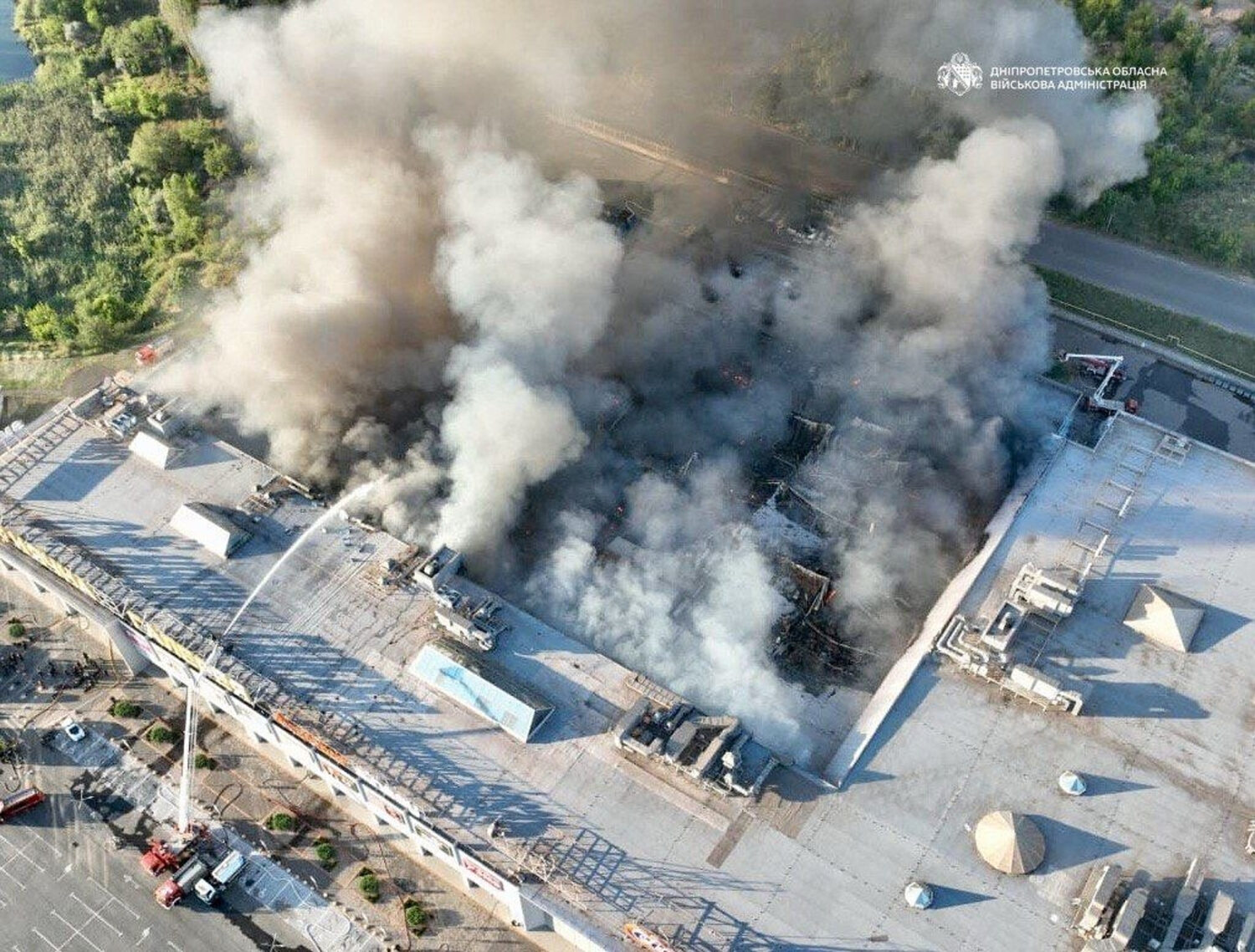 In this photo provided by the Ukrainian Military administration, firefighters work on a fire at a s...