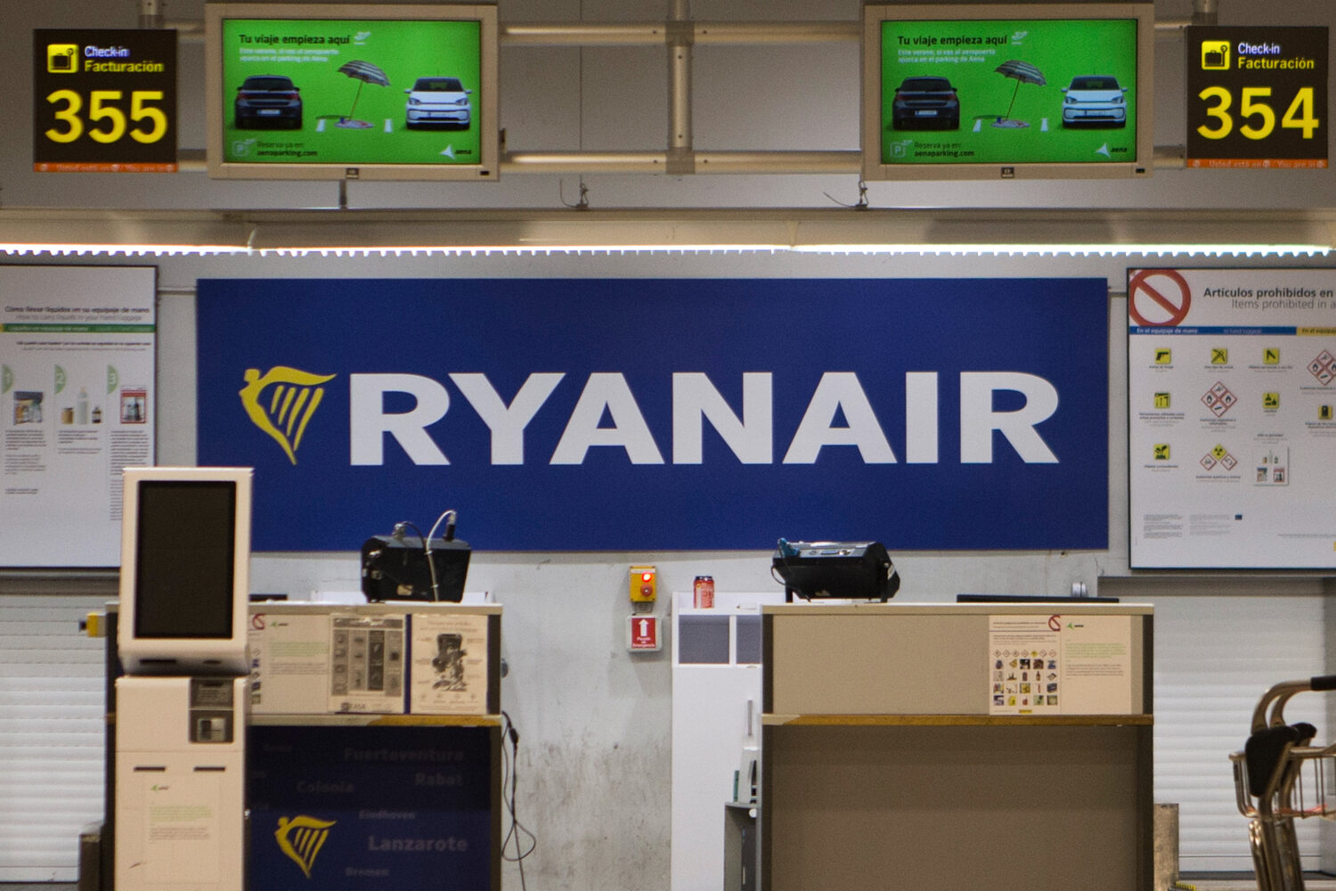 FILE - The Ryanair desk is seen, Aug. 10, 2018, at the Barajas airport in Madrid, Spain. (AP Photo/...