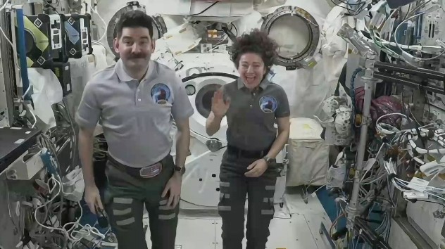 NASA astronauts Jessica Meir and Jack Hathaway participate in an interview while aboard the Interna...