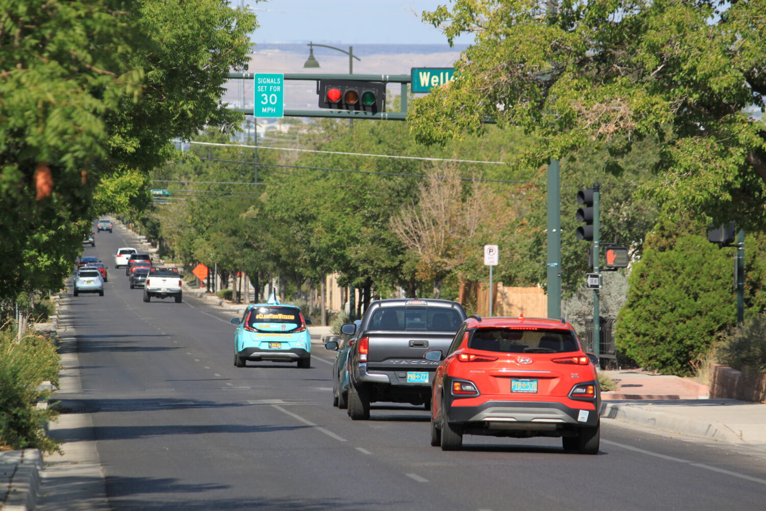 Vehicles stop along Lead Avenue where stoplights are set for a specific speed limit as part of the ...