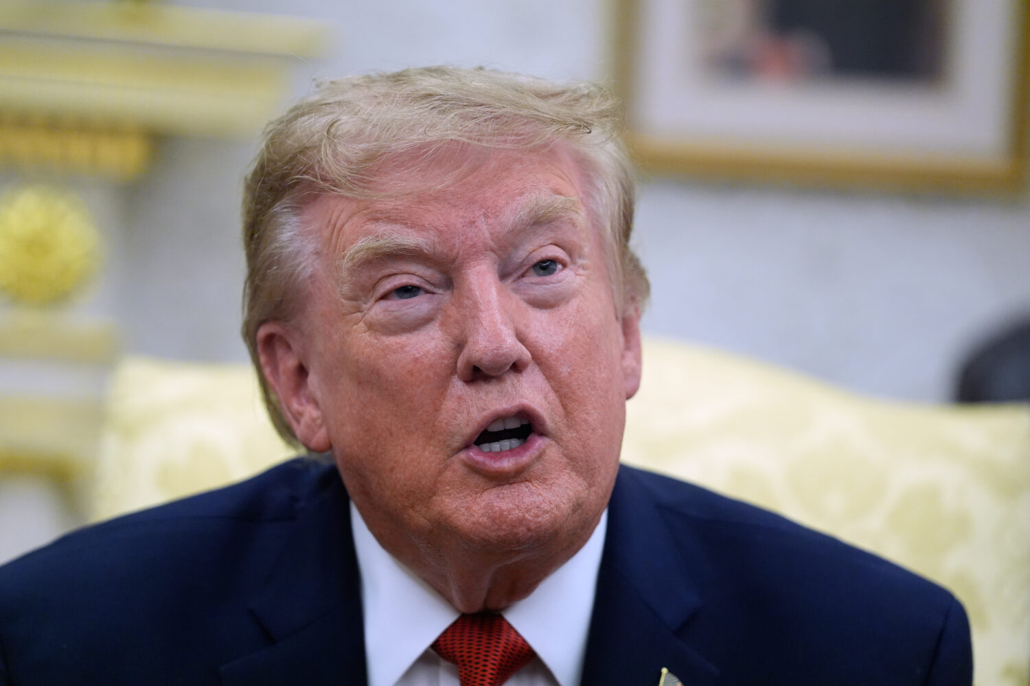 President Donald Trump speaks as he meets with lifeguard Ryder Williams in the Oval Office of the W...