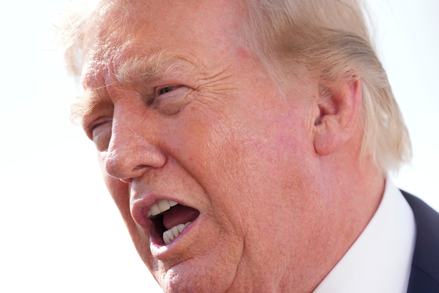 President Donald Trump speaks with reporters before boarding Air Force One, Friday, Aug. 21, 2026, ...
