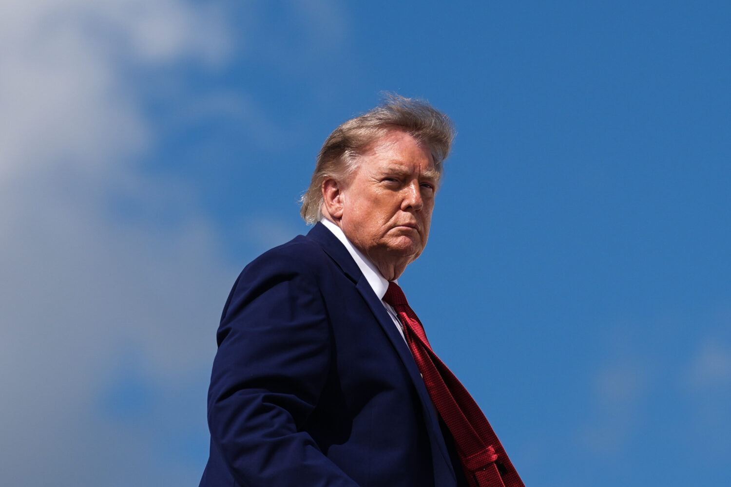 FILE - President Donald Trump boards Air Force One, Aug. 7, 2026, at Joint Base Andrews, Md. (AP Ph...