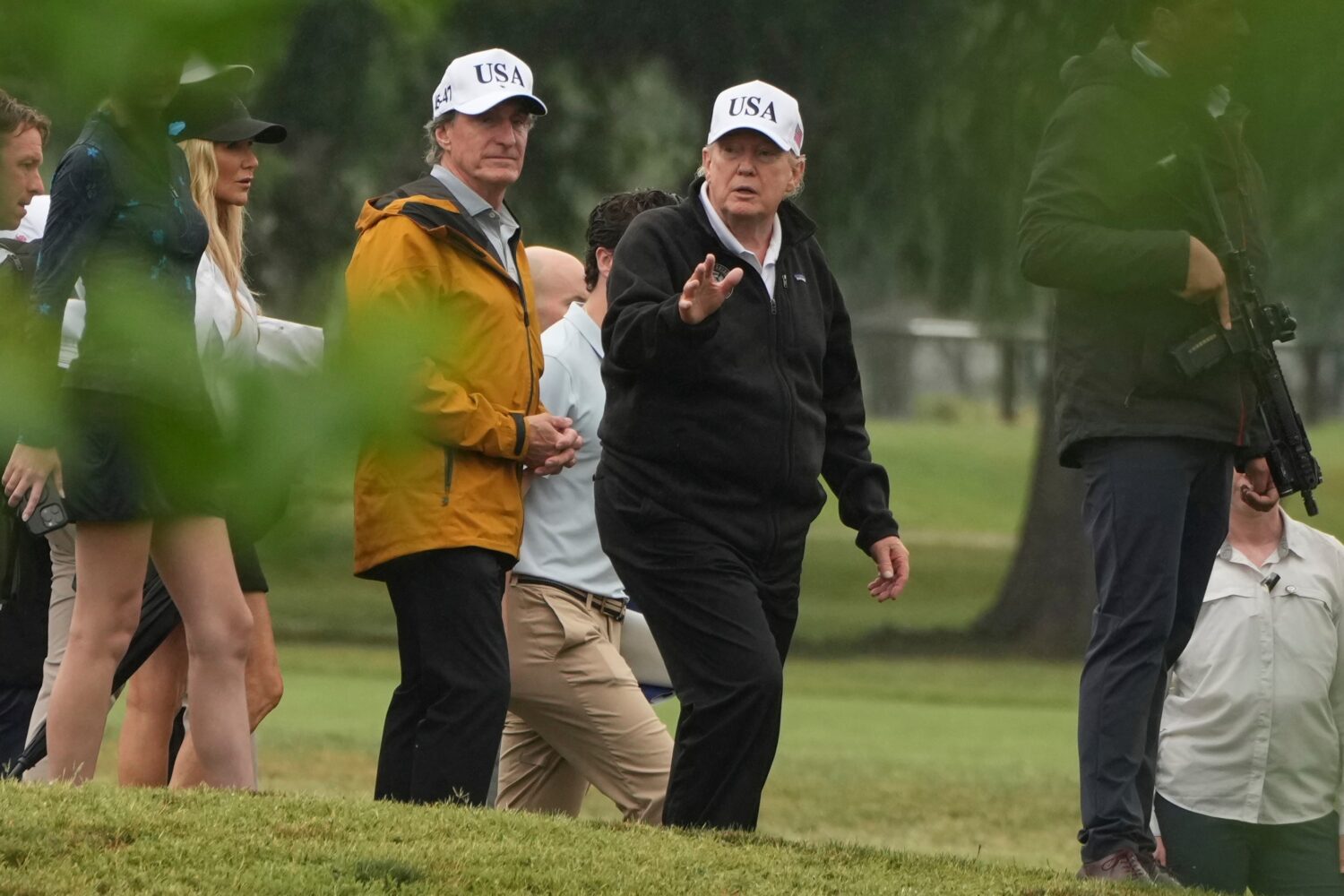 FILE - President Donald Trump, right, and Interior Secretary Doug Burgum tour the East Potomac Park...