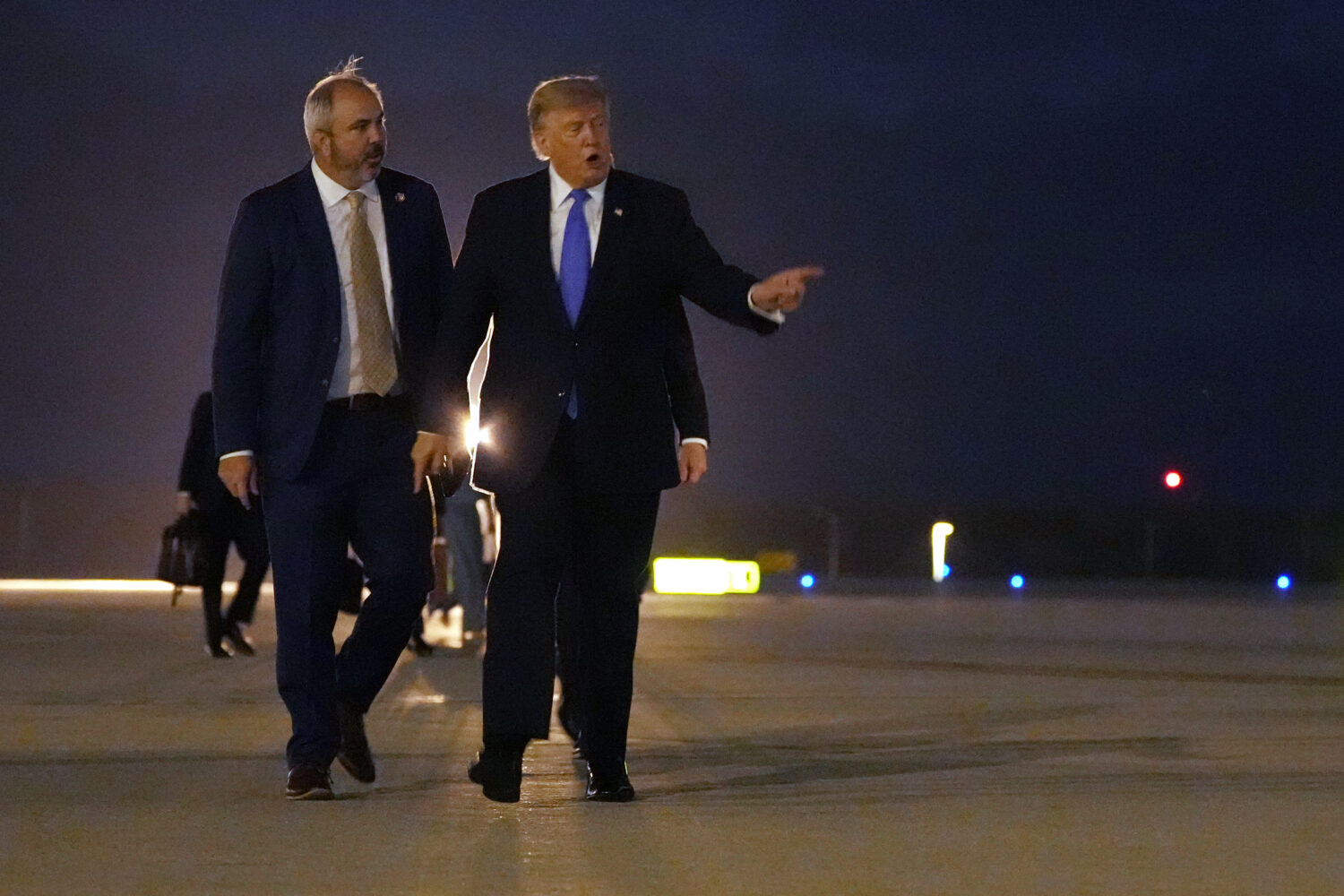 President Donald Trump walks to board Air Force One, Tuesday, Aug. 4, 2026, at Los Angeles Internat...