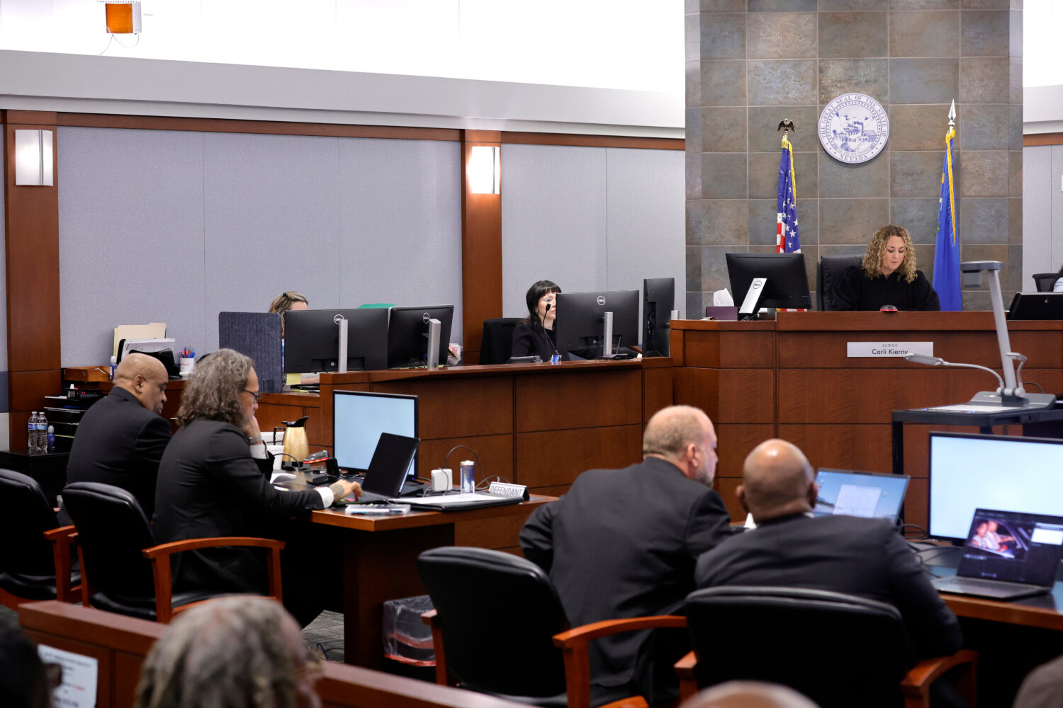 District Court Judge Carli Kierny, top right, reads jury instructions before closing arguments in t...