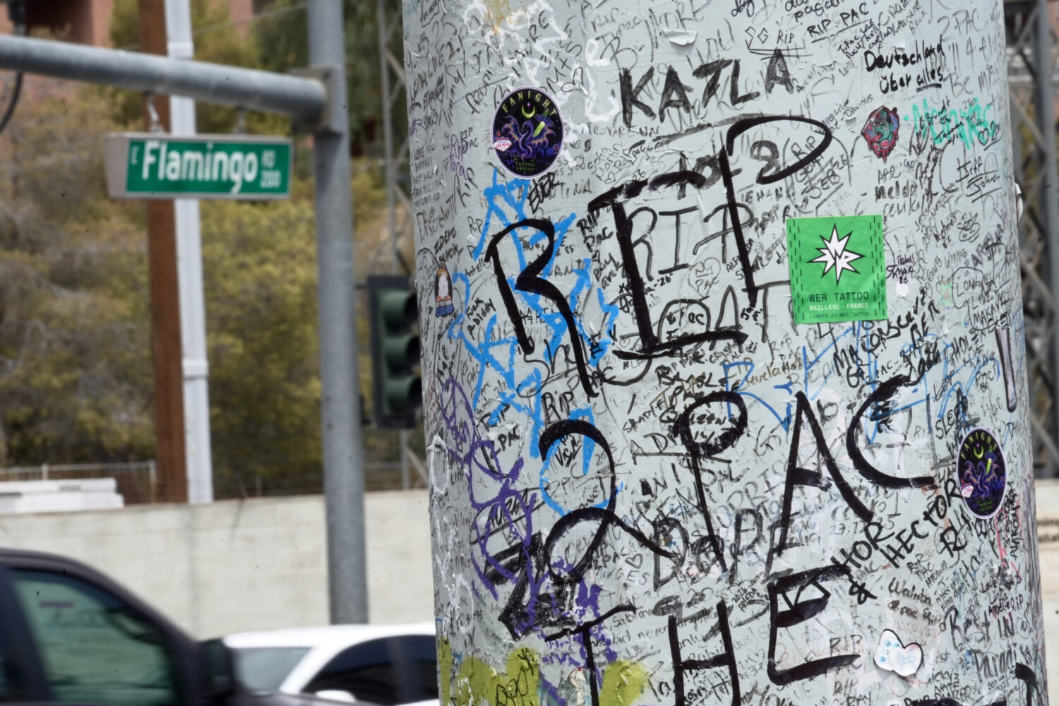 Graffiti about Tupac is seen on a pole Monday, Aug. 10, 2026, near the intersection where he was sh...