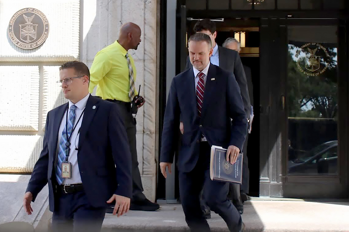 United States Trade Representative Jamieson Greer, center, leaves the U.S. Department of Commerce f...