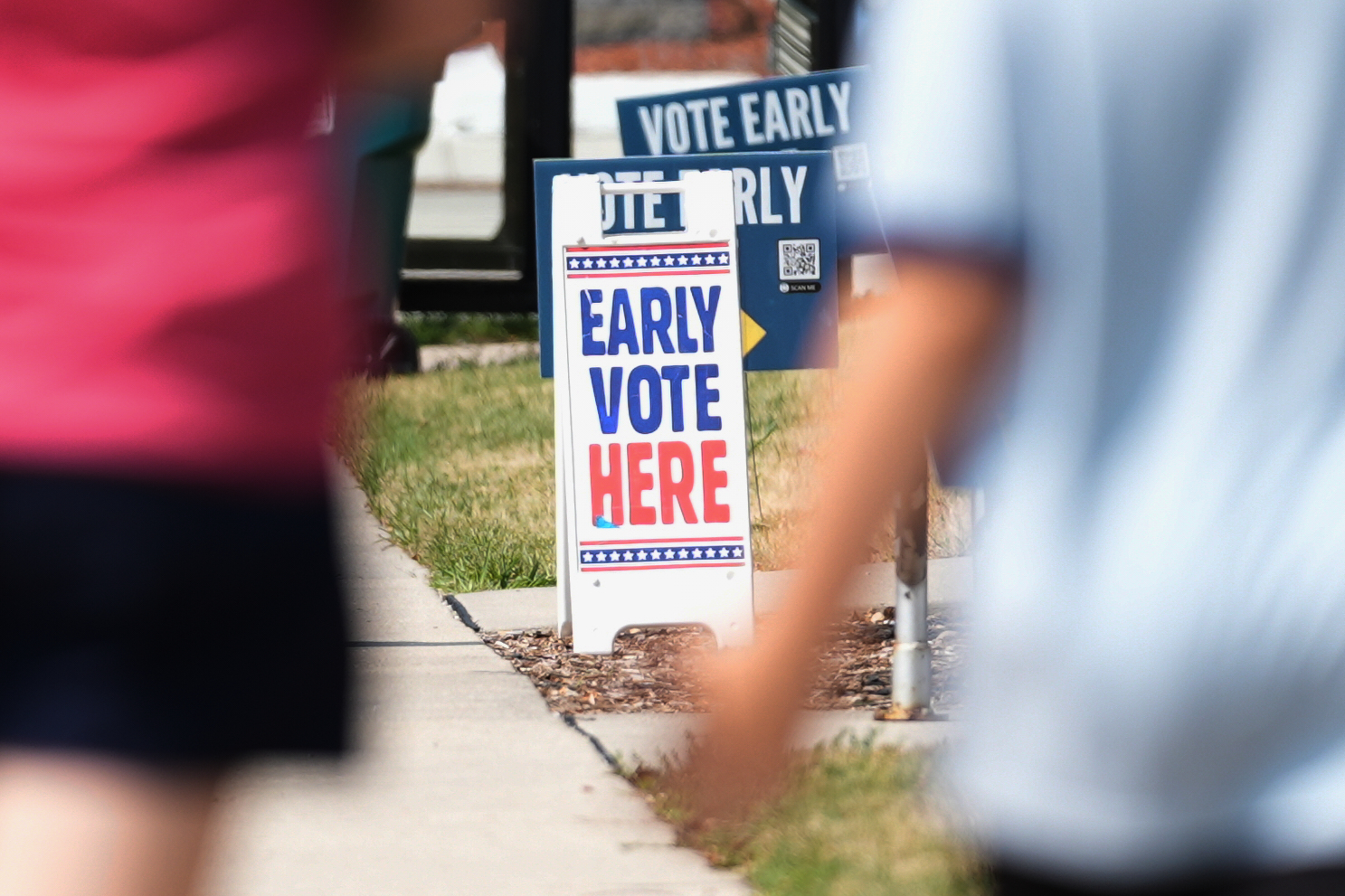 Signs are displayed outside a polling place, Tuesday, July 28, 2026, in Milwaukee. (AP Photo/Nam Y....