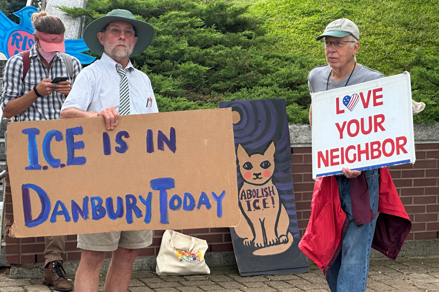Anti-ICE activists gather outside a courthouse in Danbury, Conn., Thursday, Aug. 27, 2026. (AP Phot...