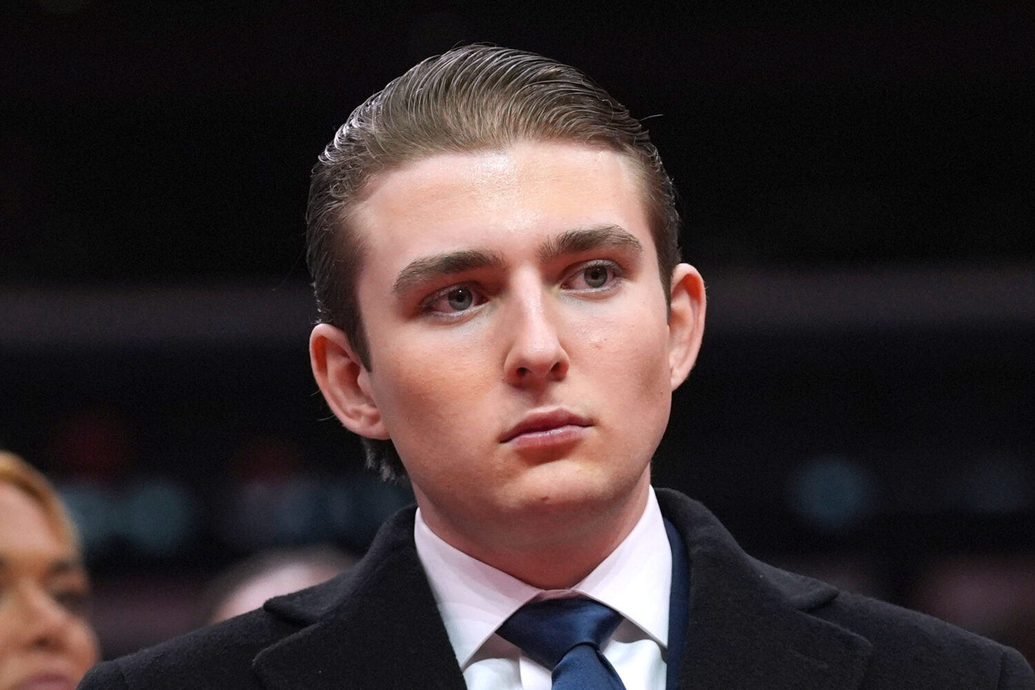 FILE - Barron Trump watches as his father, President Donald Trump attends an indoor Presidential In...