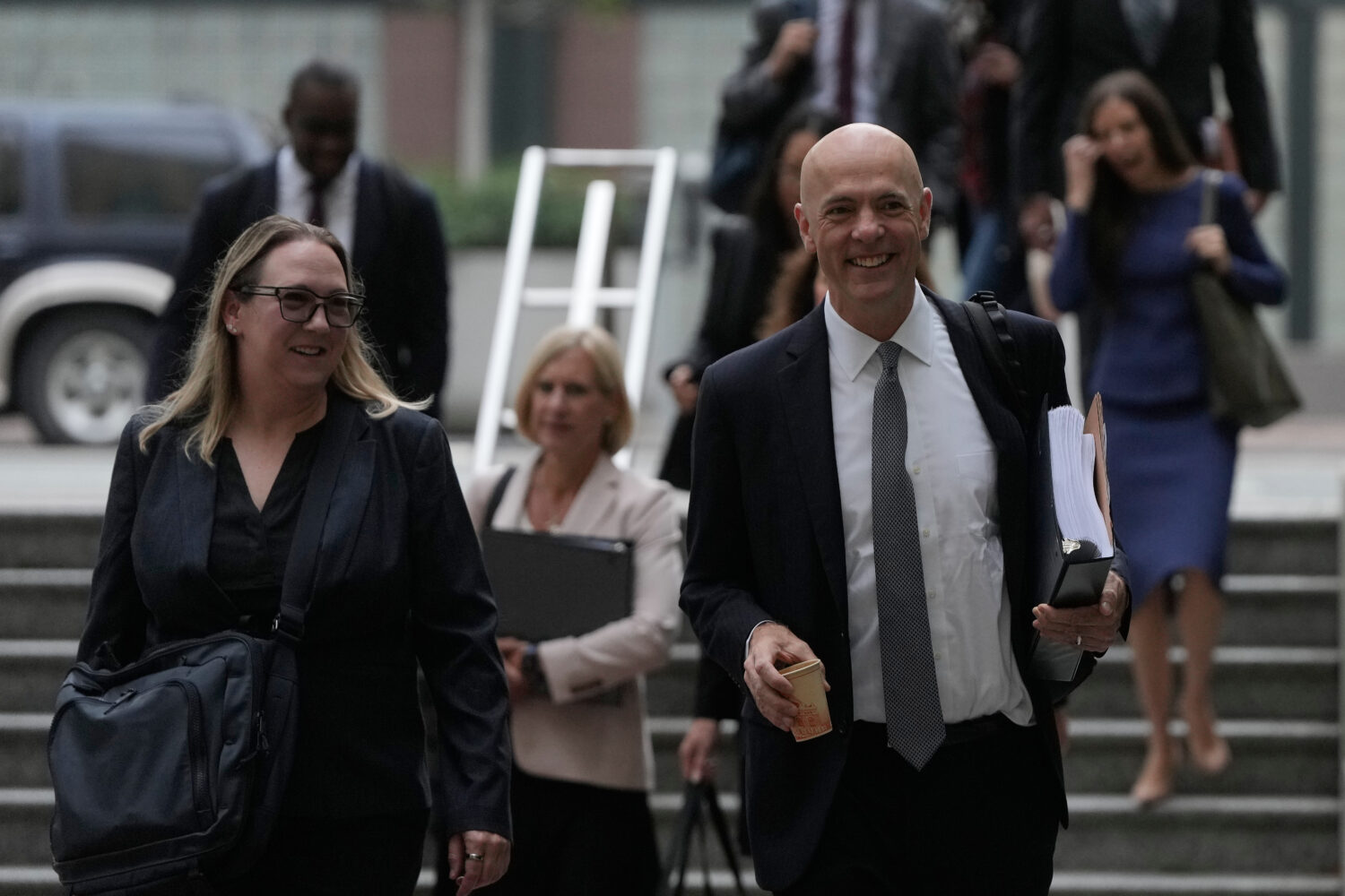 Attorney Paul W. Schmidt, representing Meta, right, arrives at a Federal Courthouse Wednesday, Aug....