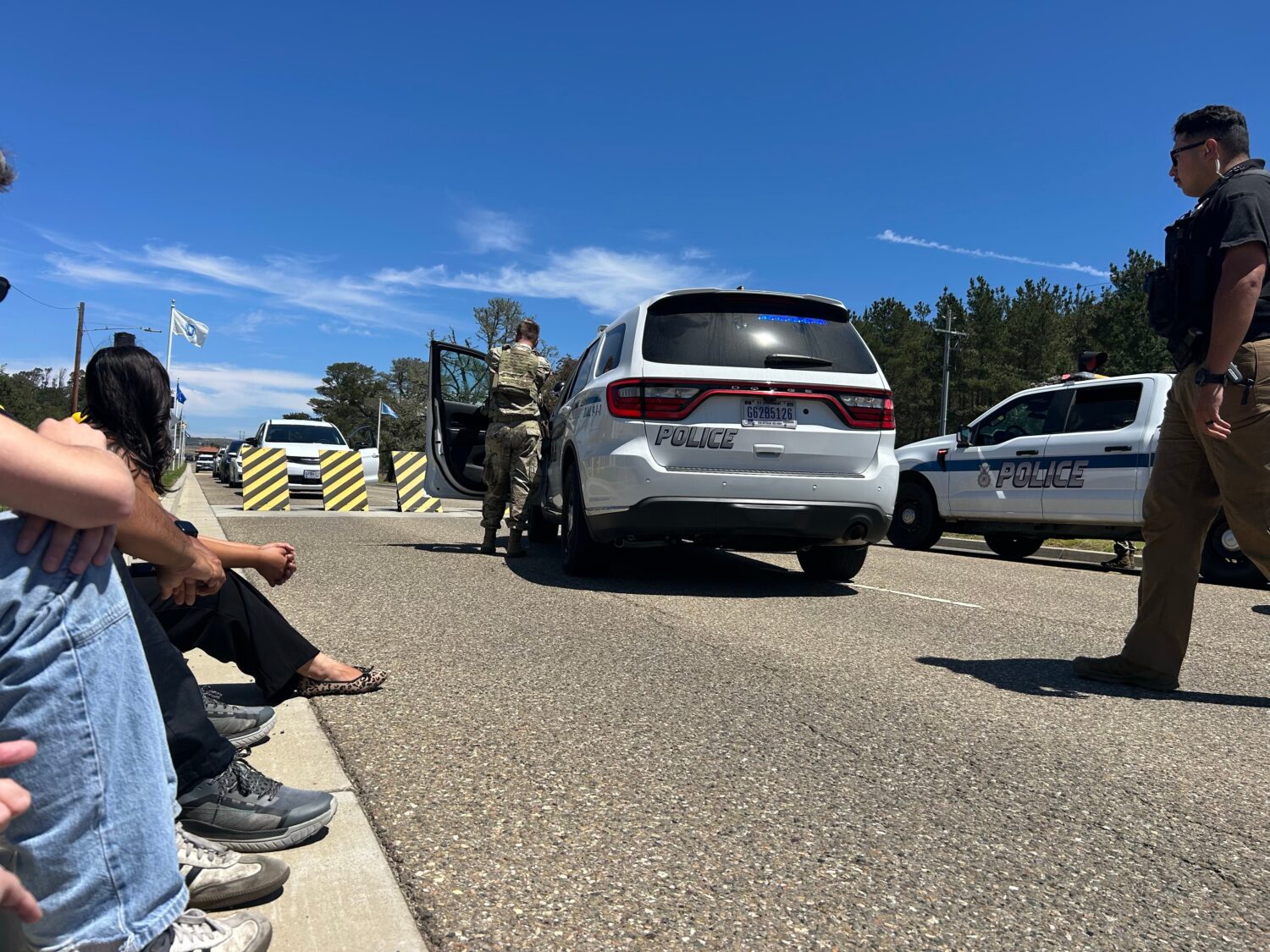 Journalists wait after being stopped by security officers at Vandenberg Space Force Base in Califor...