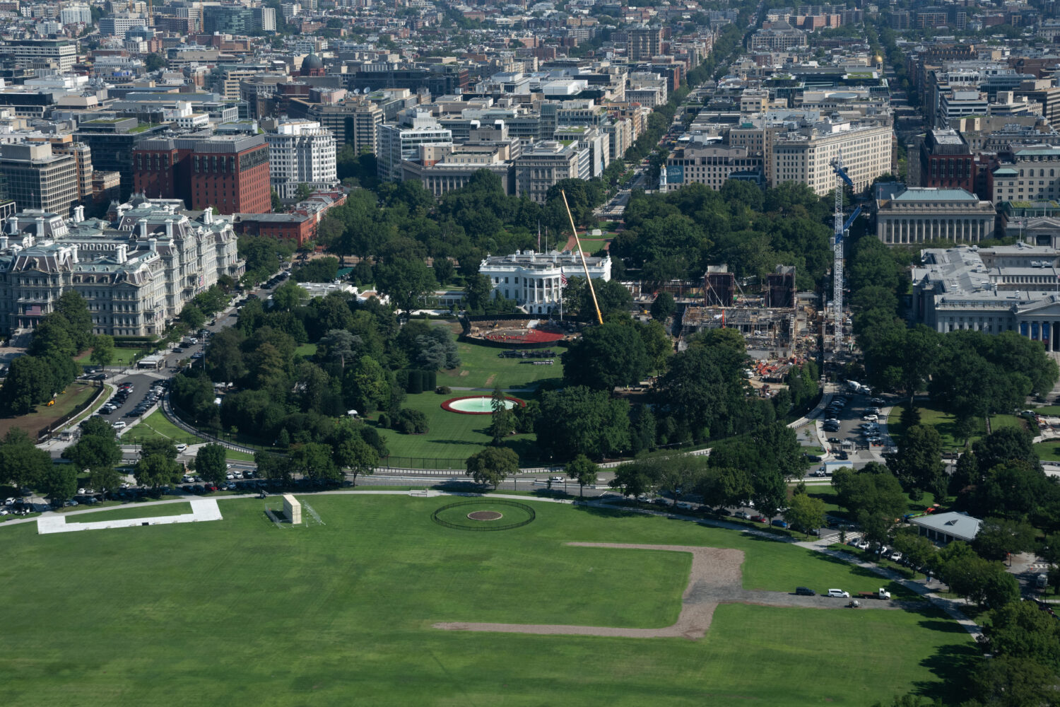 Construction continues on the helipad, center, and ballroom, right at White House, Friday, Aug. 7, ...