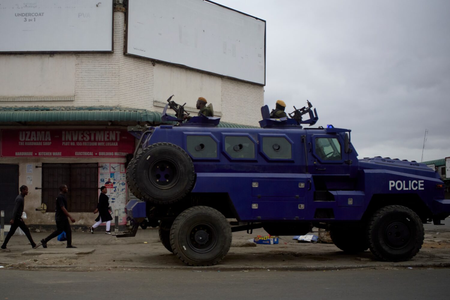 A police vehicle is parked on a sidewalk, on the outskirts of Lusaka, Zambia, Friday, Aug. 14, 2026...