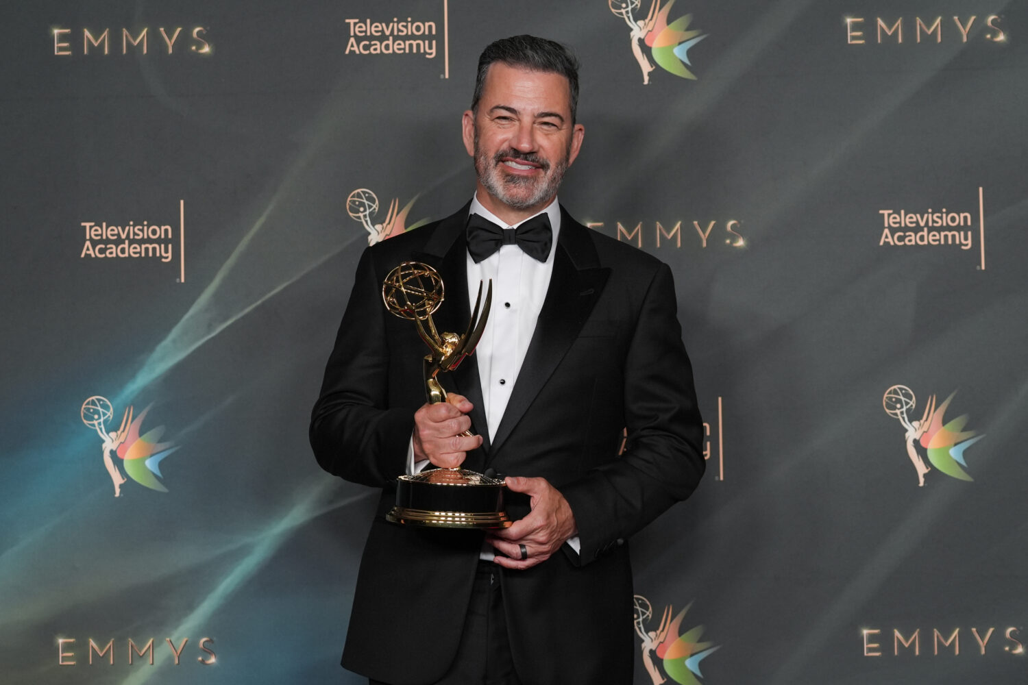 Jimmy Kimmel poses with the award for outstanding host for a game show for "Who Wants to Be a Milli...