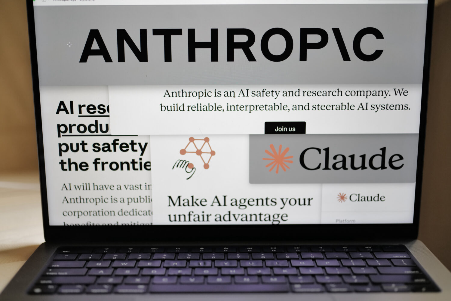 FILE - Pages from the Anthropic website and the company's logos are displayed on a computer screen ...