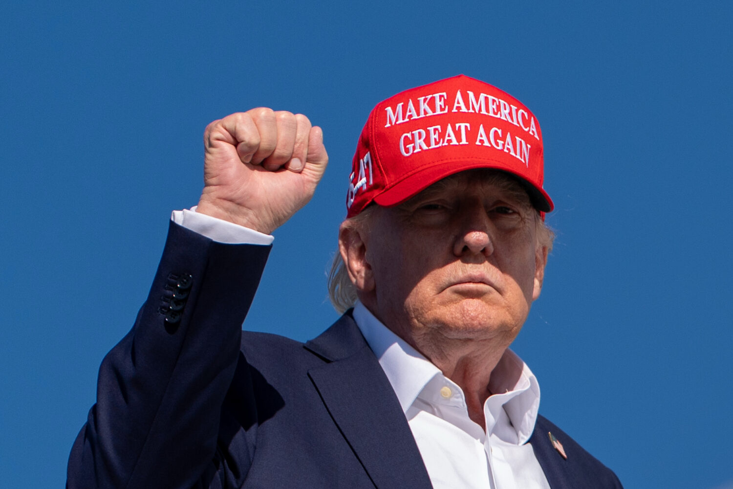 President Donald Trump gestures while boarding Air Force One at Morristown Airport, Monday, Sept. 7...