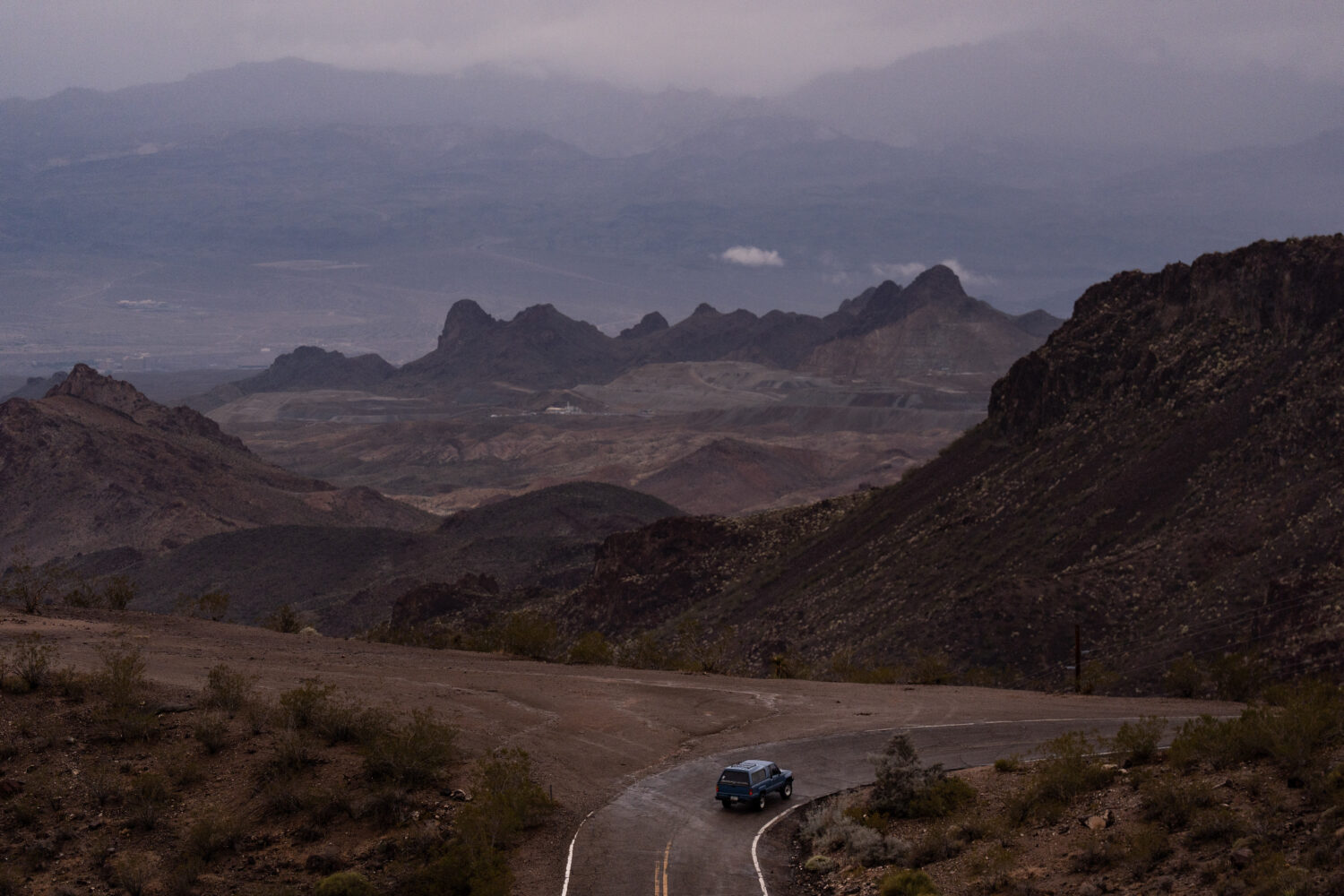 FILE - A car drives along Oatman Highway on historic Route 66, near Oatman, Ariz., on Friday, Nov. ...