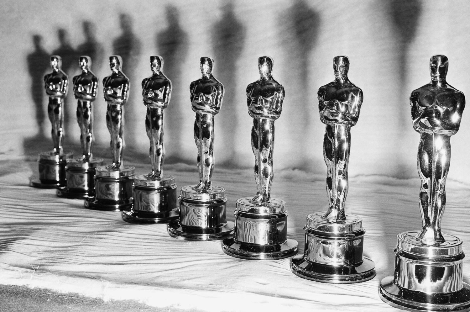 FILE - Oscar statuettes stand in a row, ready for the the presentation of the 22nd annual Academy A...