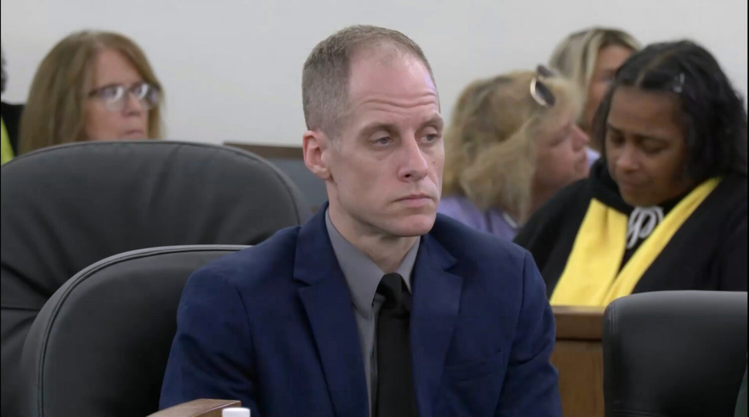 Caleb Flynn listens to court proceedings inside the Miami County Court of Common Pleas on Monday, S...