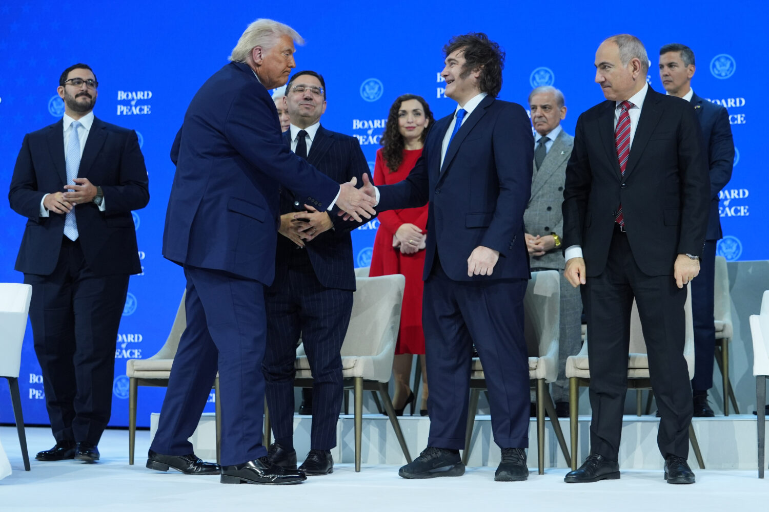 FILE - President Donald Trump, center left, shakes hands with Javier Milei, President of Argentina,...