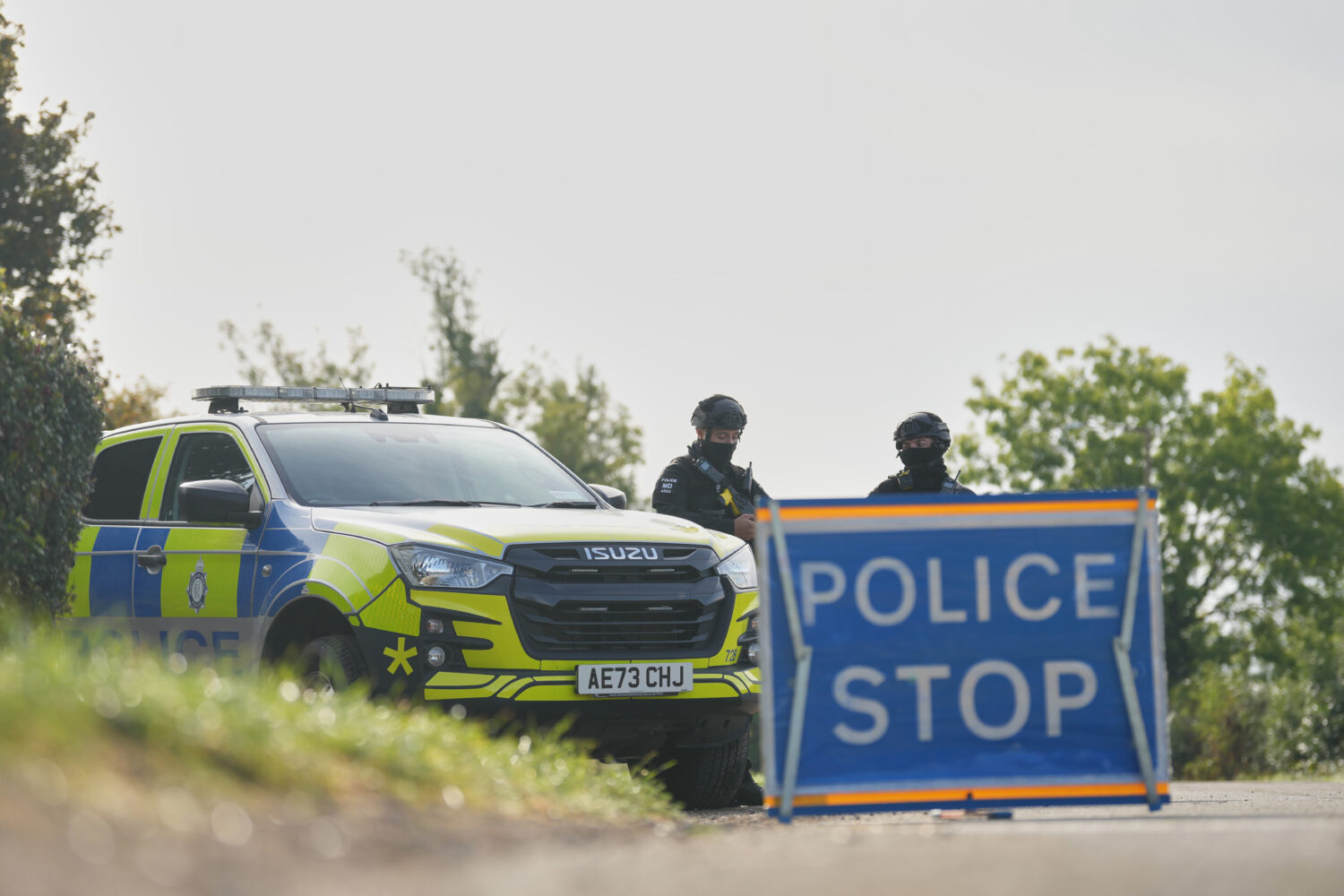 Police guard a road leading to RAF Fairford, in Fairford, England, Monday, Sept. 28, 2026. (AP/Alas...