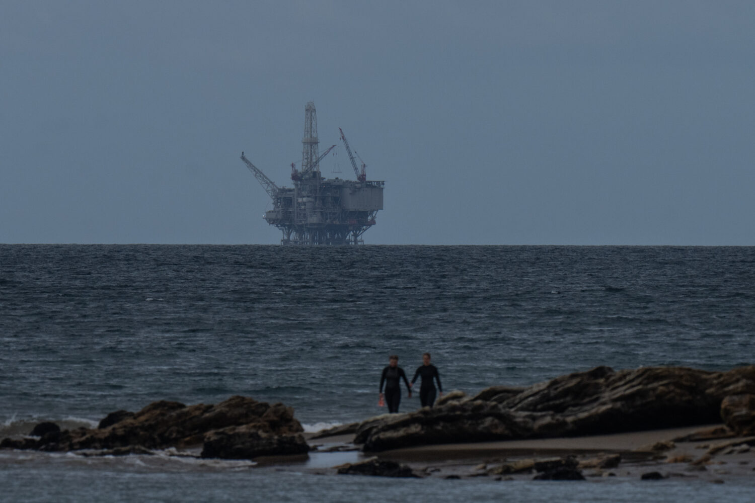 FILE - An offshore drilling platform operated by Sable Offshore Corp. is seen from Refugio State Be...