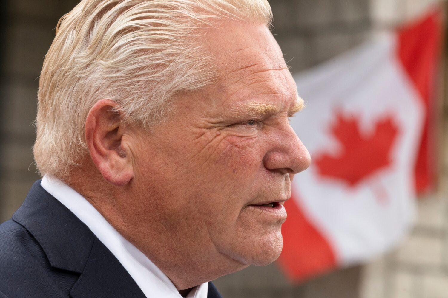 Ontario Premier Doug Ford speaks to media at a housing development in Hamilton, on Monday, Aug. 24,...