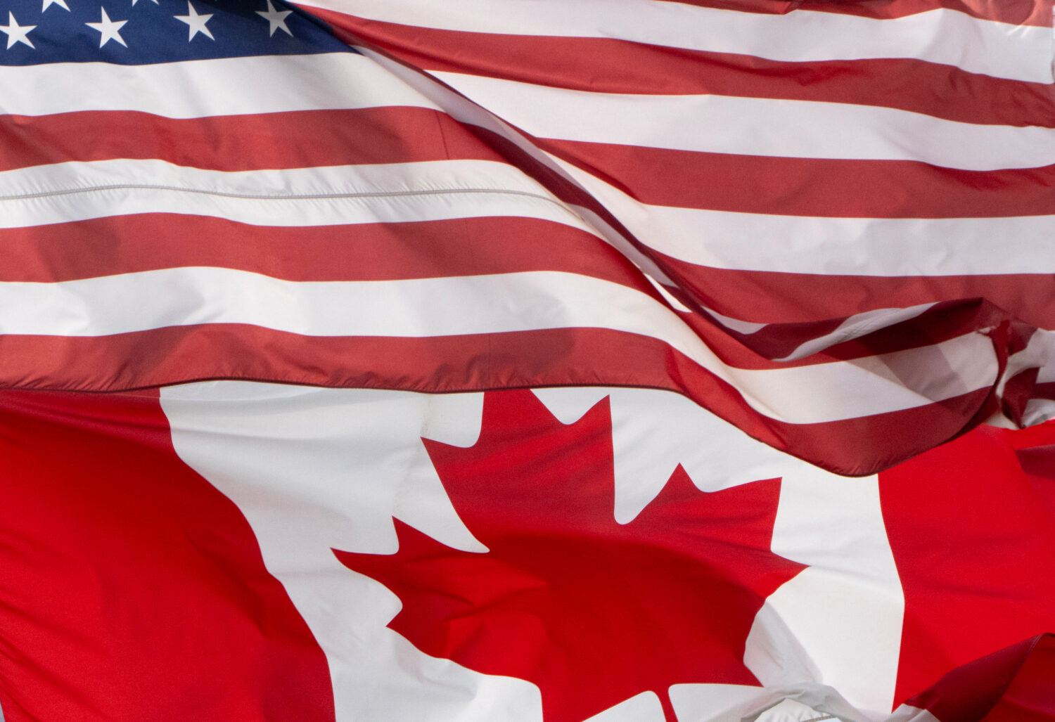 The flags of Canada and the United States fly over a stadium in Ottawa, Saturday, Sept. 12, 2026. (...