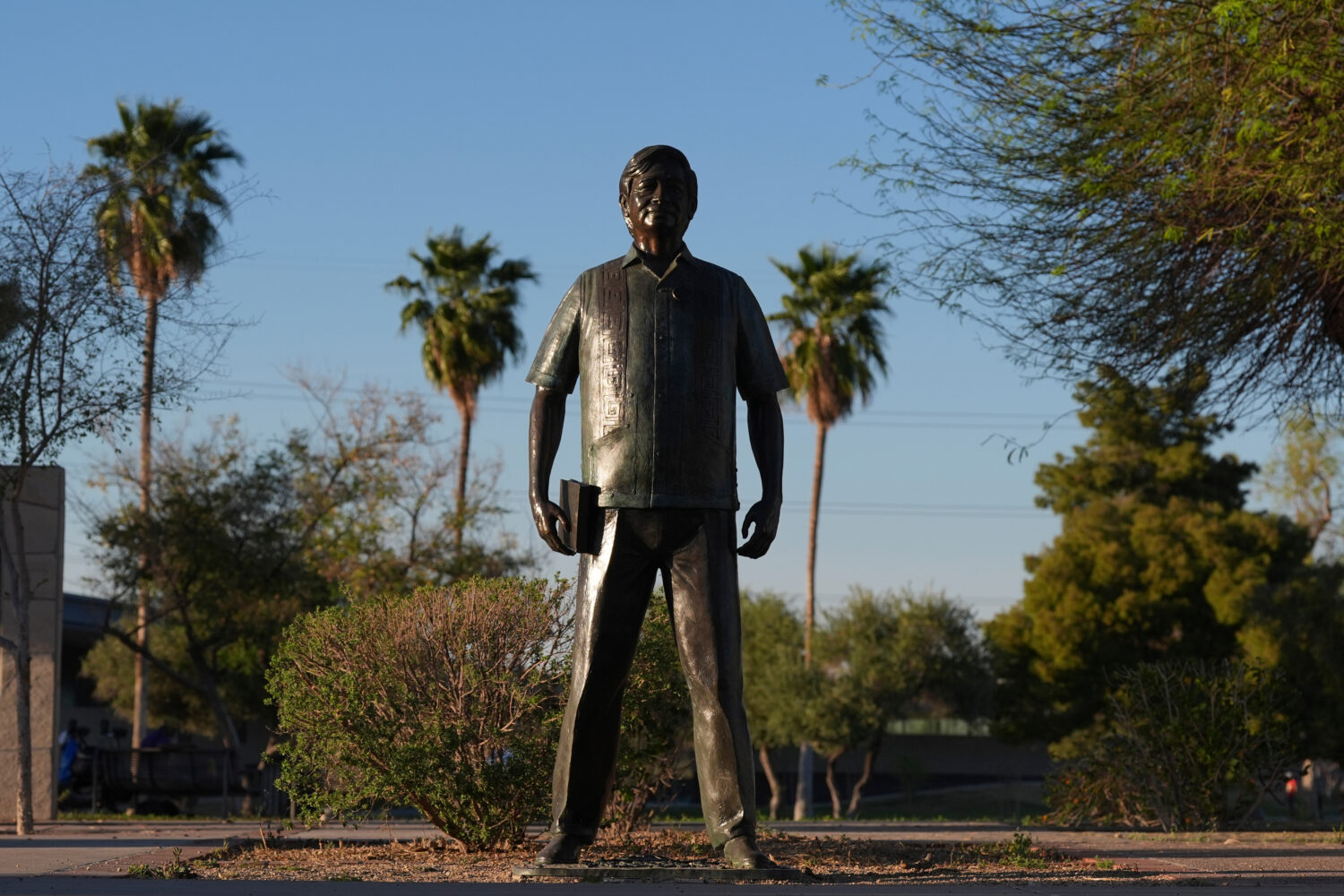 FILE - A statute of César Chavez stands in the middle of a plaza at Cesar Chavez Park, honoring th...