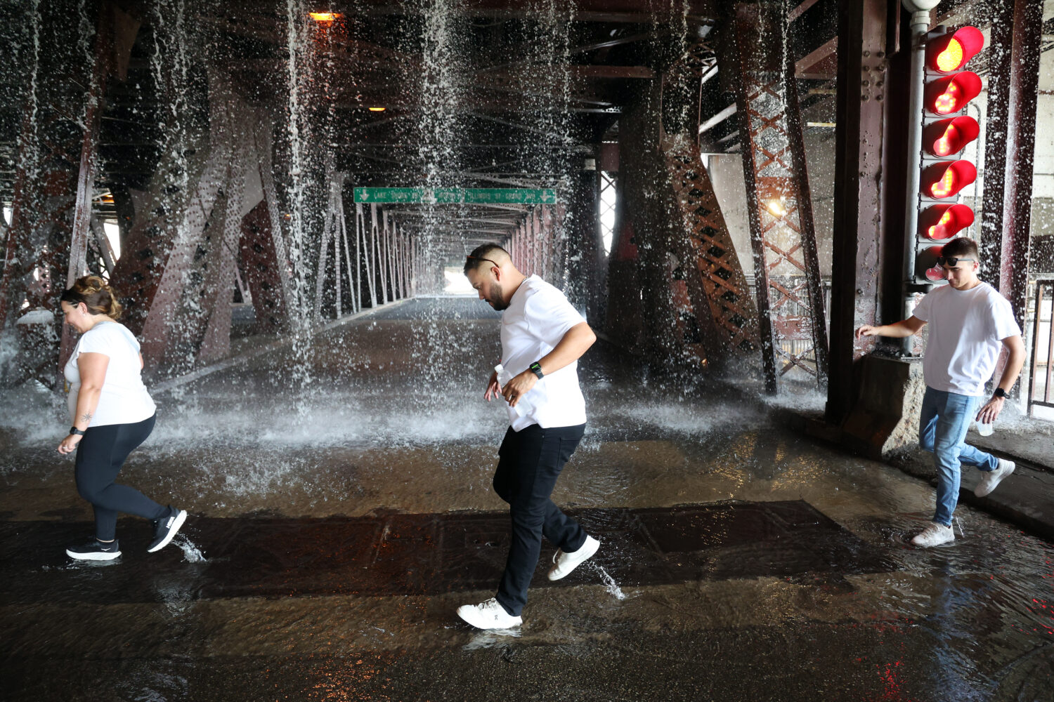 People scamper west across the lower level of the DuSable Lake Shore Drive bridge over the Chicago ...