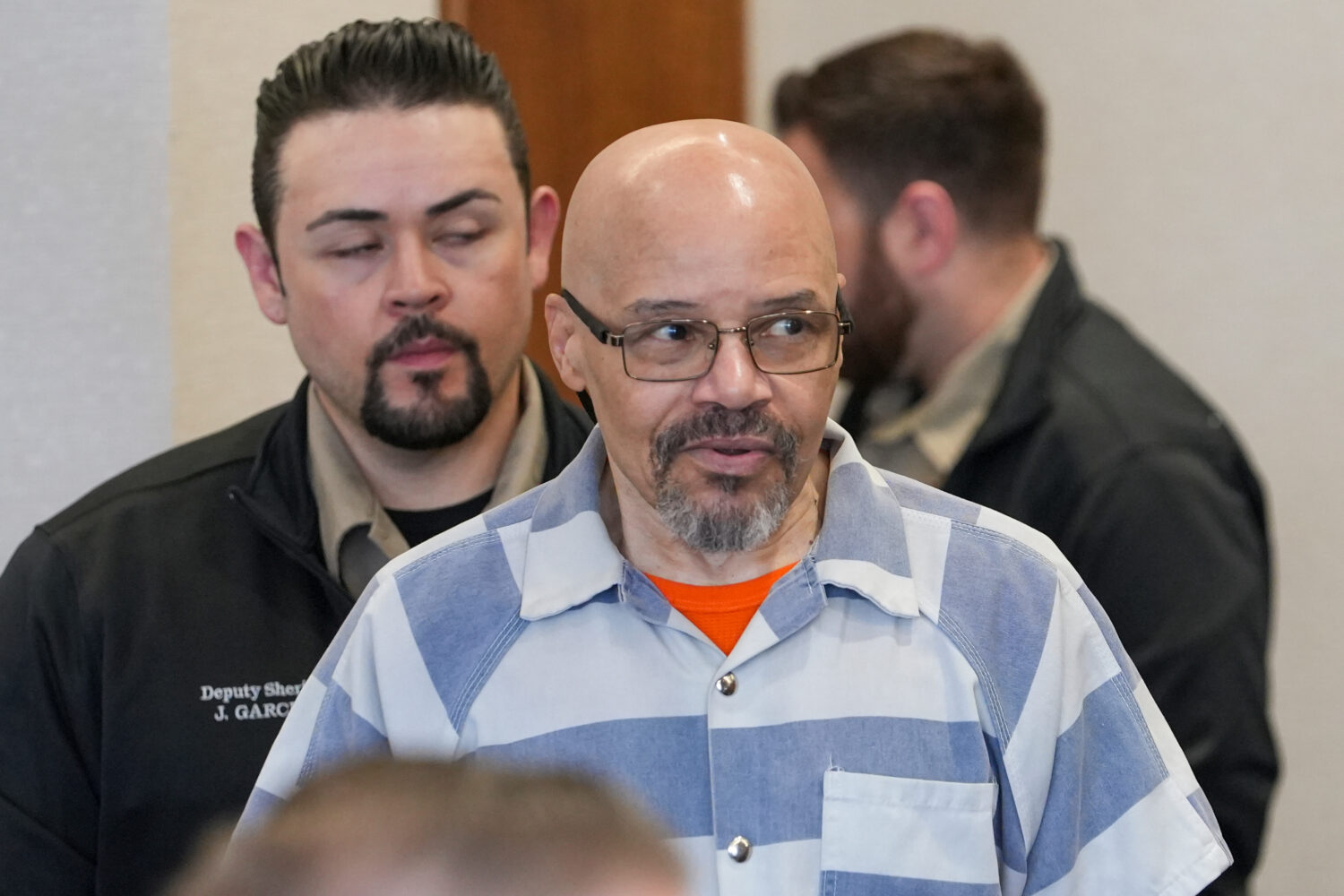 FILE - Douglas Carter is brought into the courtroom for a hearing in 4th District Court in Provo, U...