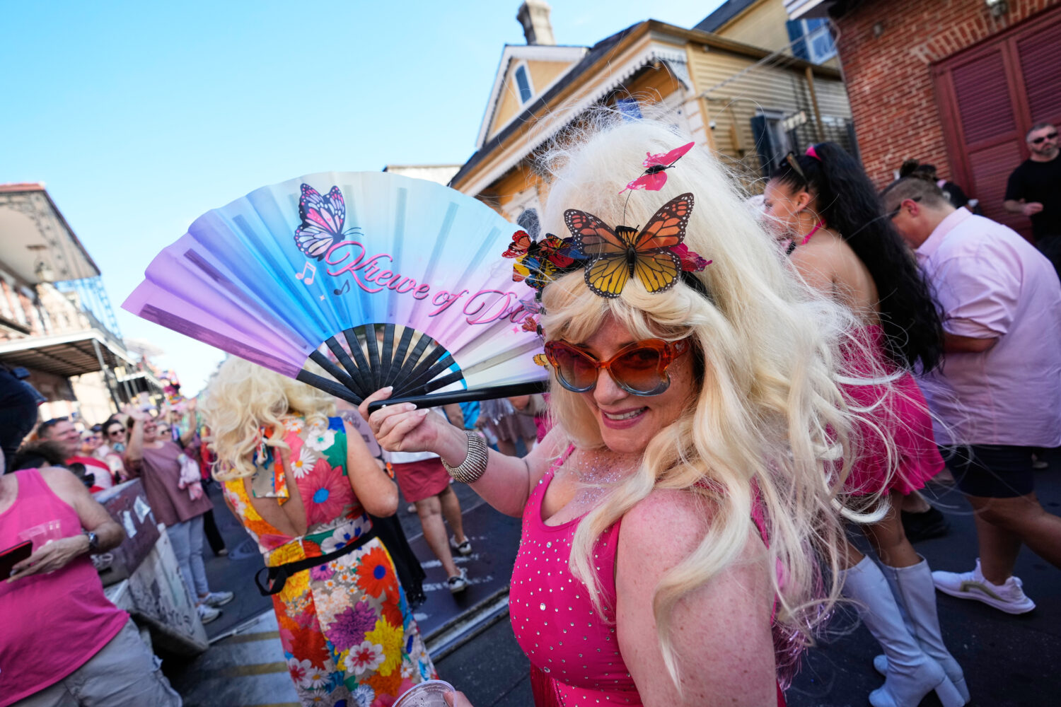 Members of the Krewe of Dolly lead a second line parade in commemoration of the life of Dolly Parto...