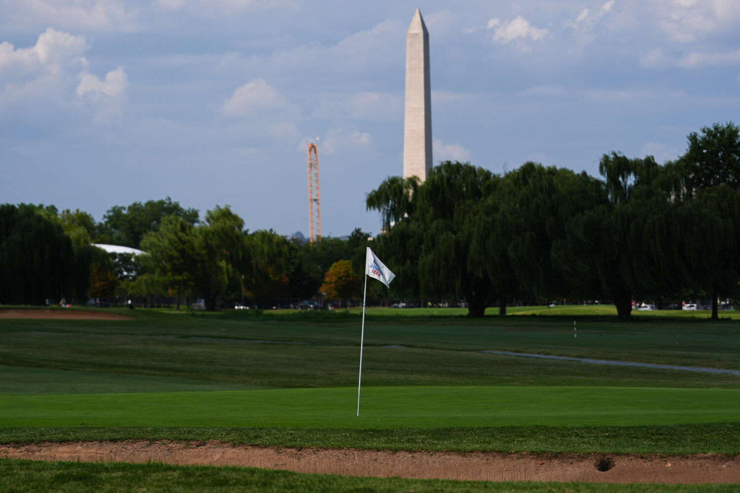 The Washington Monument is seen beyond the East Potomac Park Golf Course, Tuesday, Sept. 1, 2026, i...