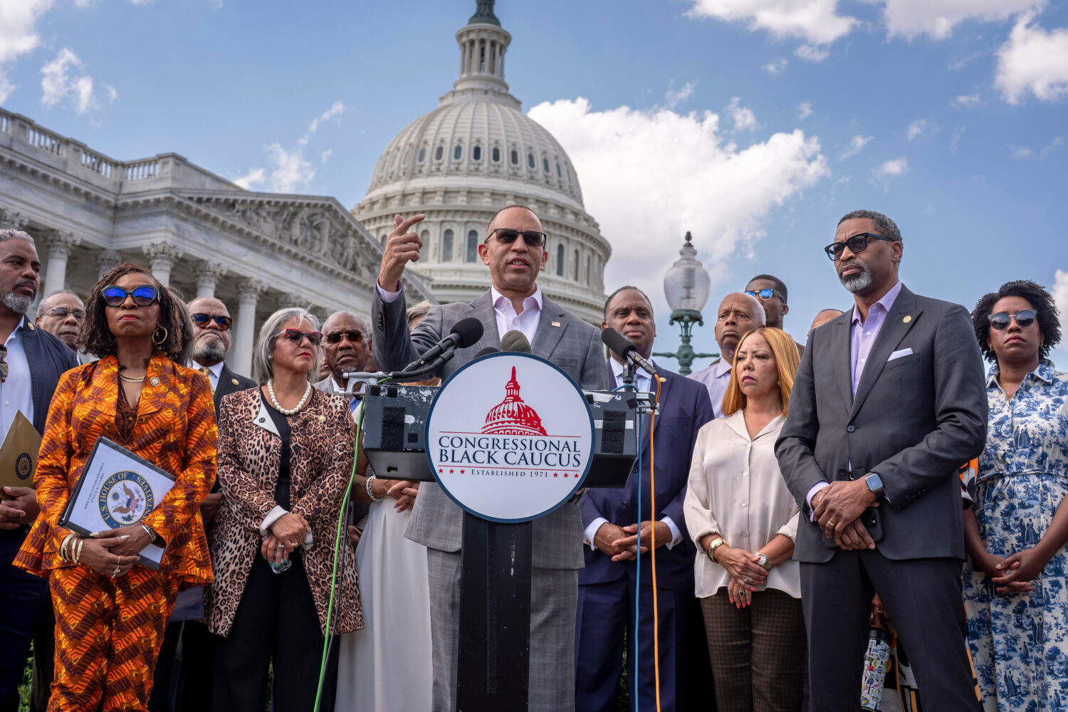 FILE - House Minority Leader Hakeem Jeffries, D-N.Y., center, and members of the Congressional Blac...