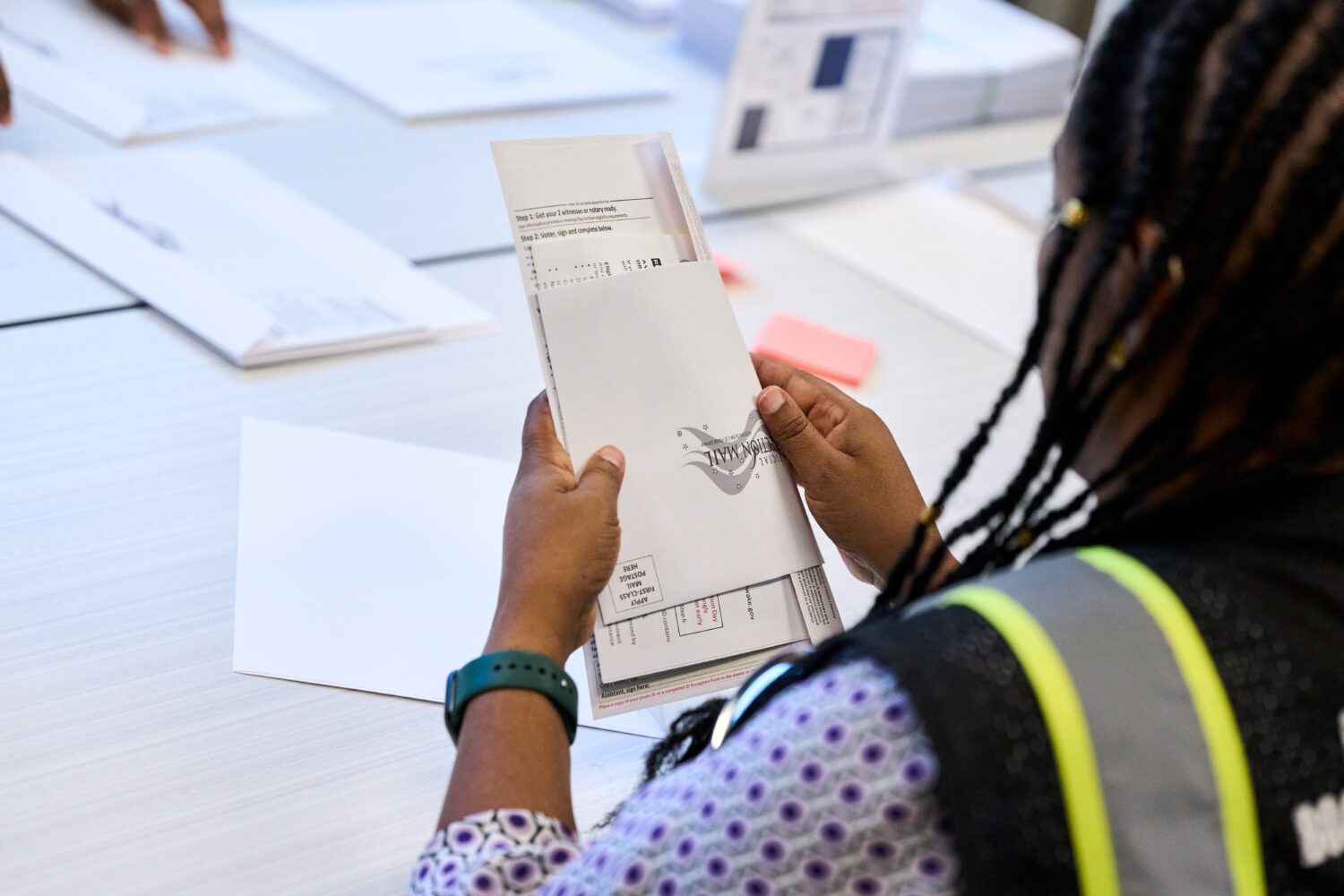Wake County Board of Elections employees prepare absentee ballots to be mailed on Thursday, Sept. 3...