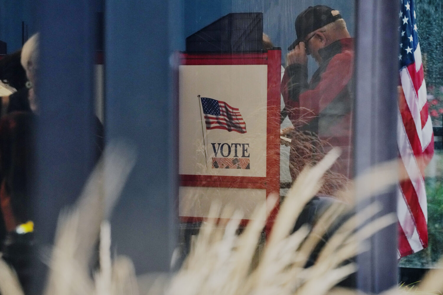A voter casts a ballot on the first day of early voting in Minnesota at the Elections & Voter Servi...