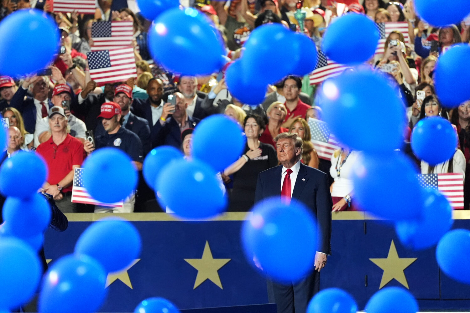 President Donald Trump watches as balloons fall at the Republican convention Thursday, Sept. 10, 20...