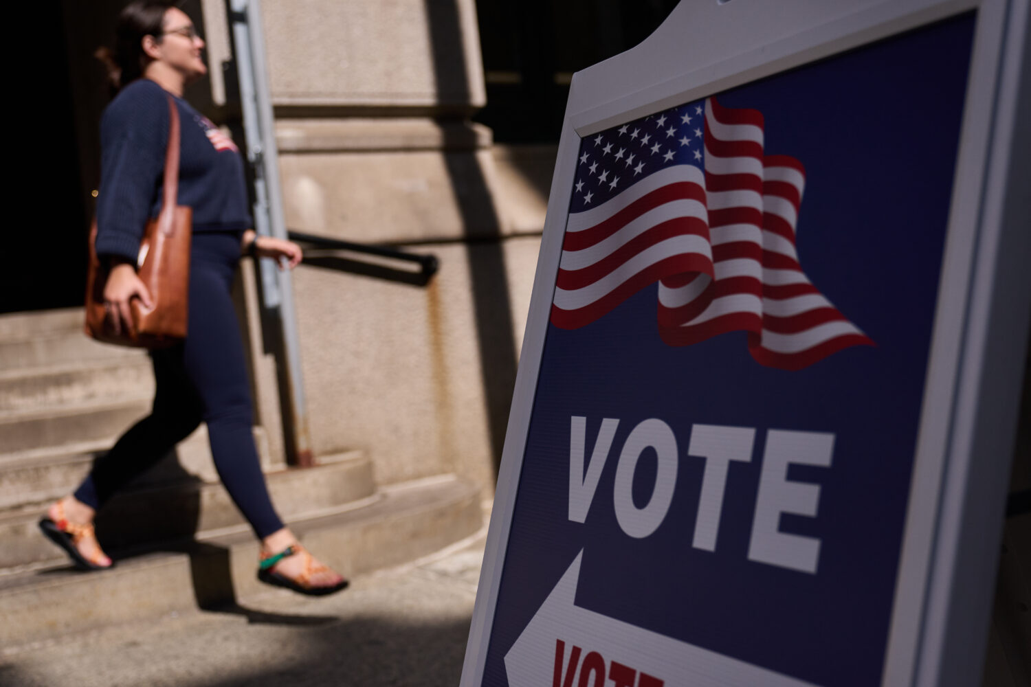 A sign directs voters to an entrance for City Hall during early voting for the Rhode Island primary...