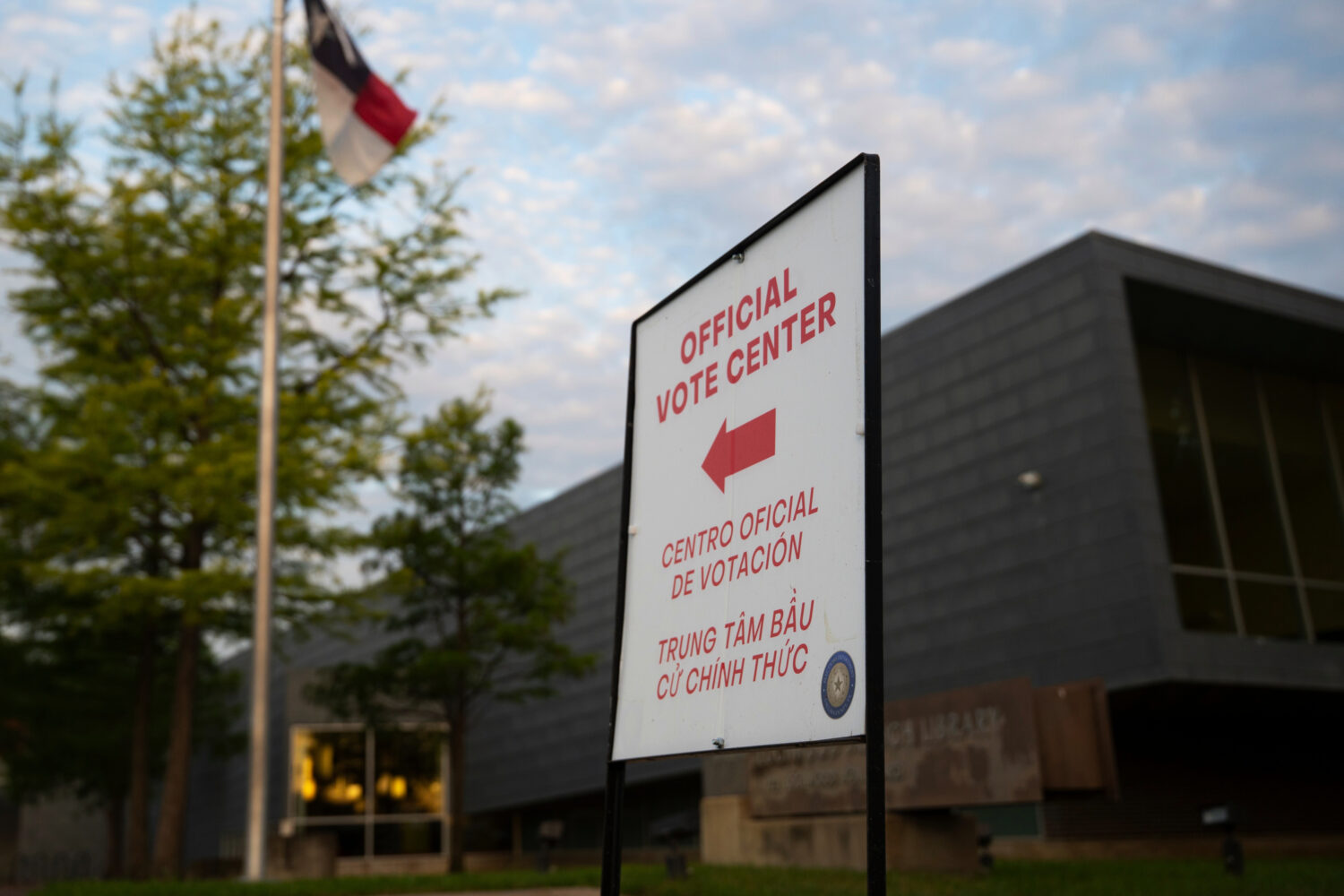FILE - An official voting center sign stands outside of a polling location on May 26, 2026, in Dall...