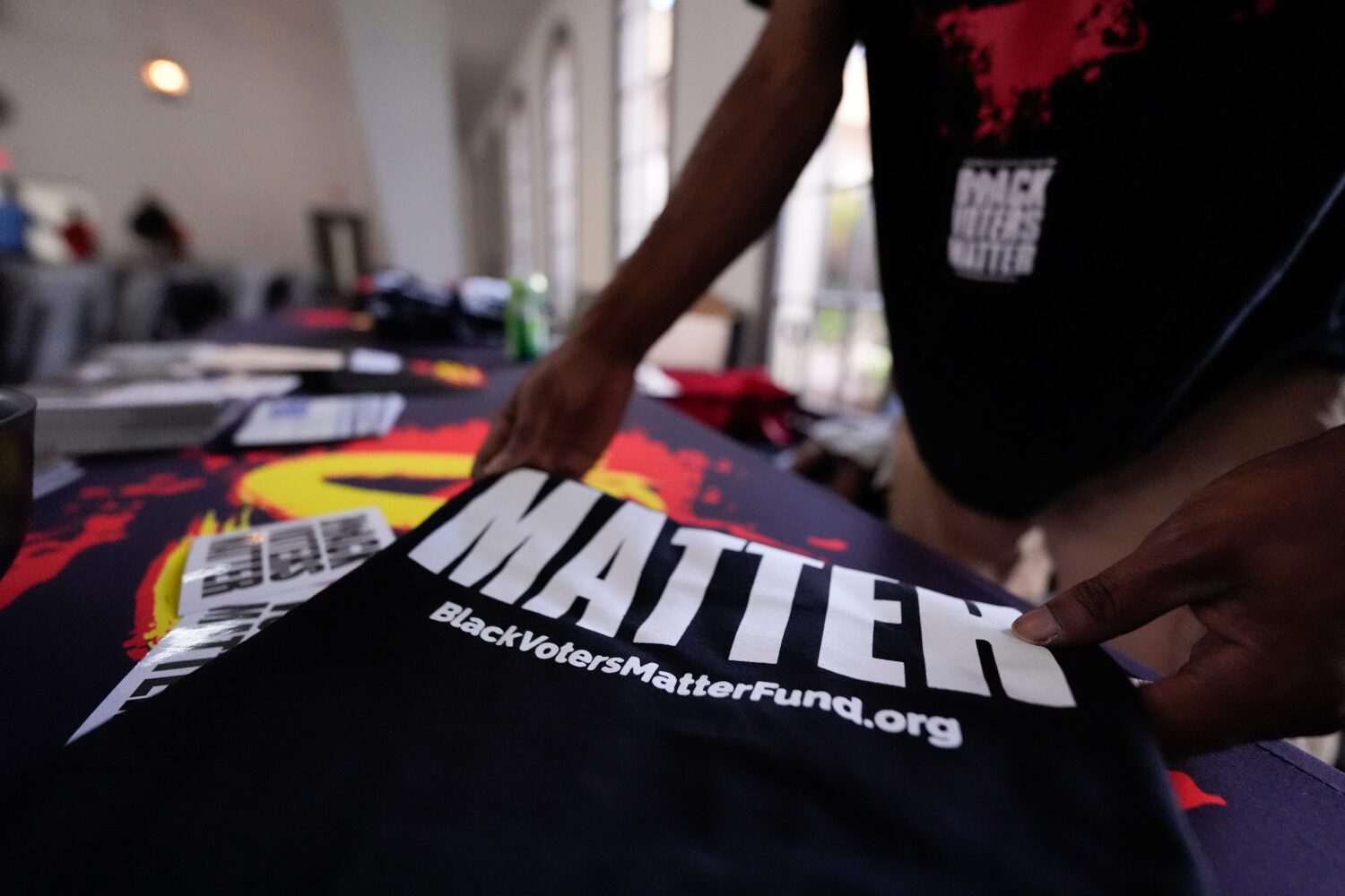 Nicholas Burns prepares his table at Bridgepointe Church during an event Wednesday, Sept. 16, 2026,...