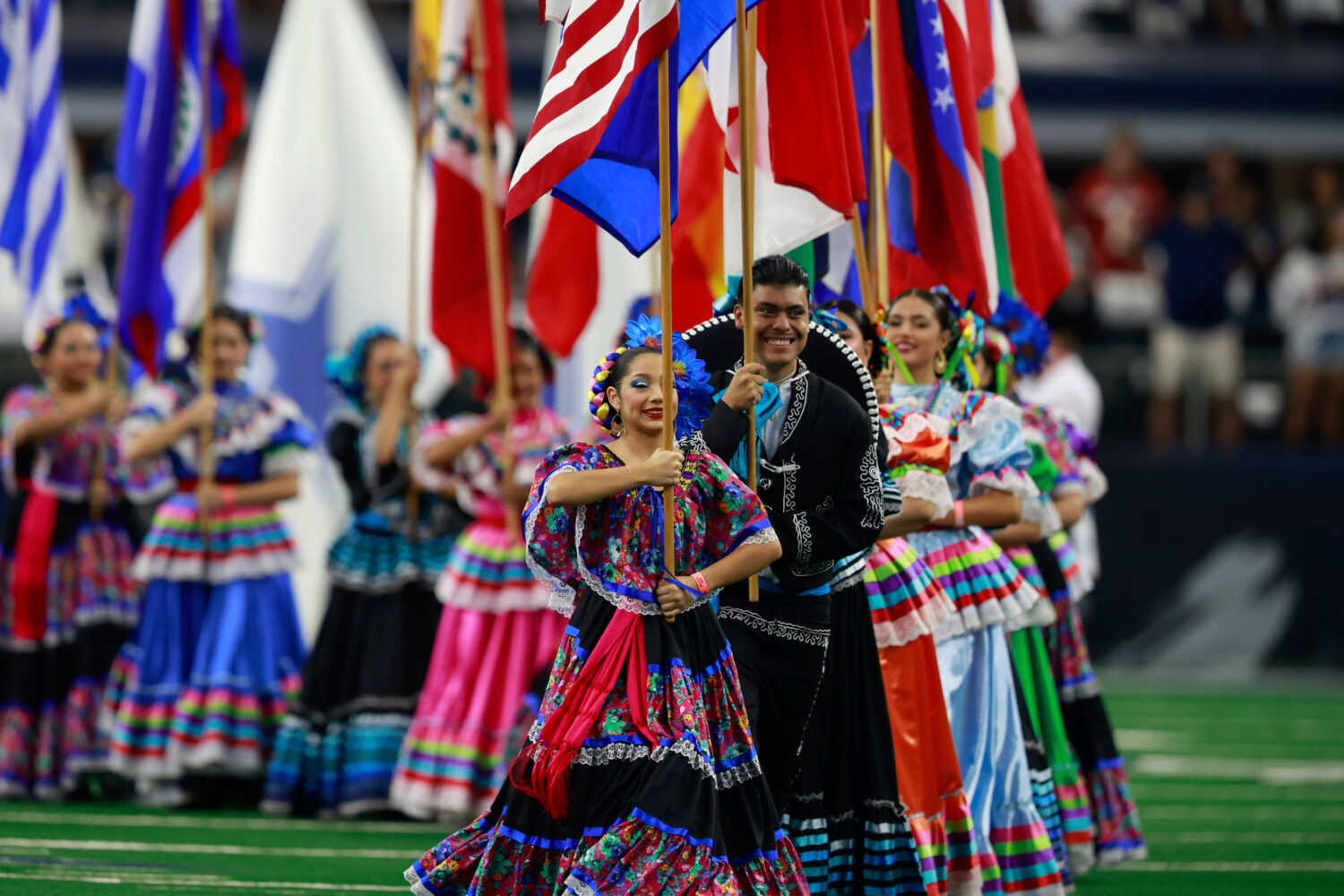 FILE - National flags from Latin American countries are displayed on the field during a celebration...