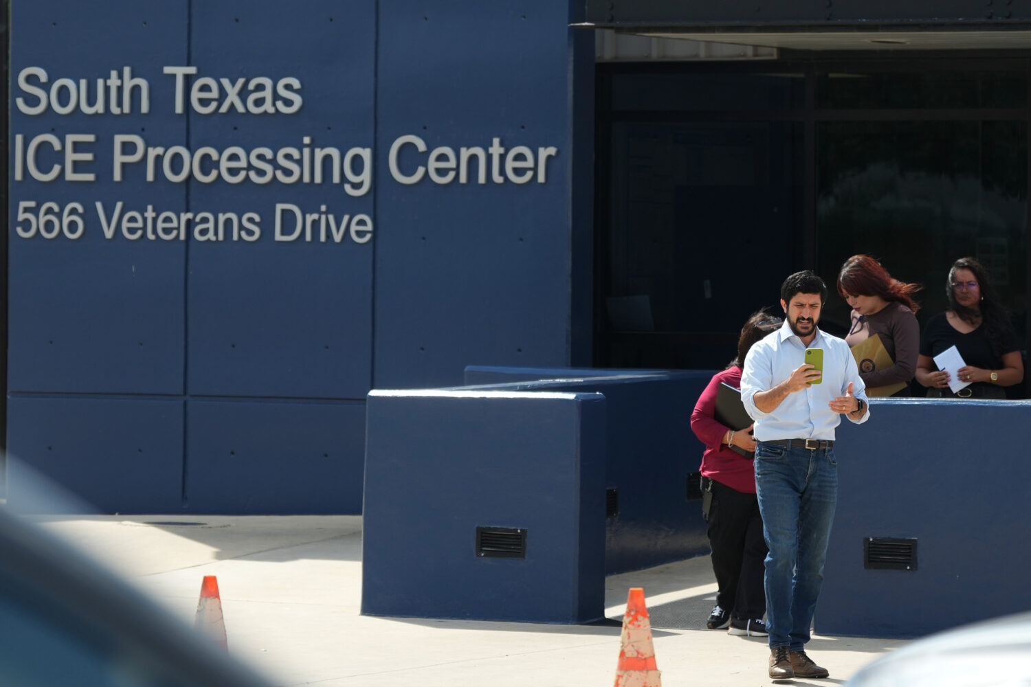 U.S. Rep. Greg Casar and members of his staff leave the South Texas ICE Processing Center where he ...