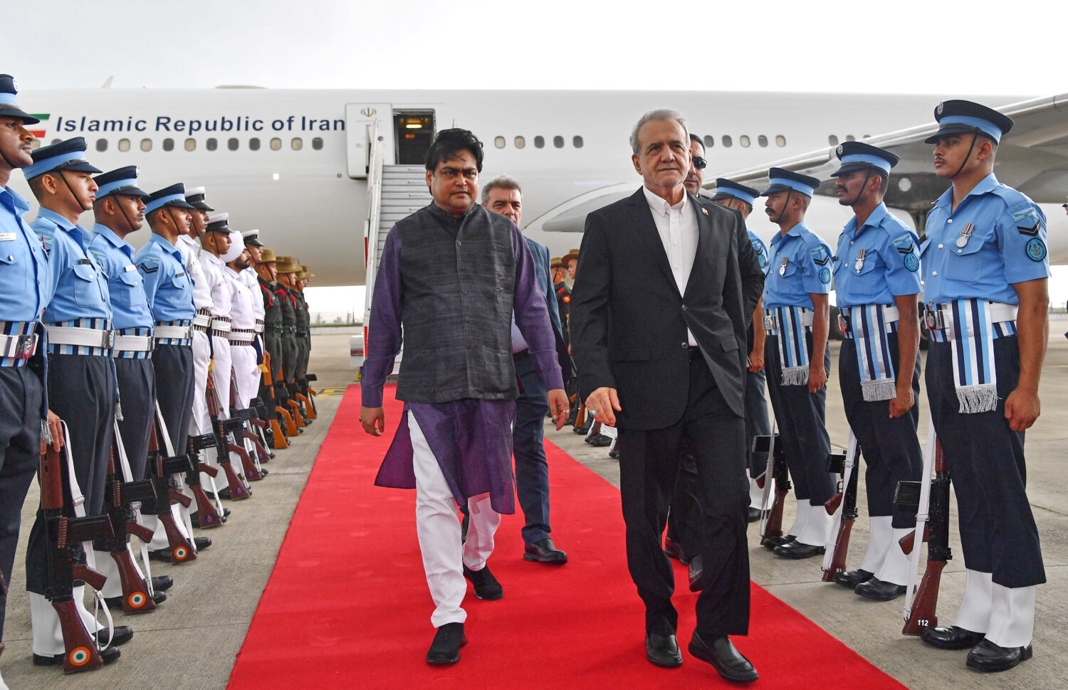 Iranian President Masoud Pezeshkian, center right, arrives for the BRICS summit in New Delhi, India...