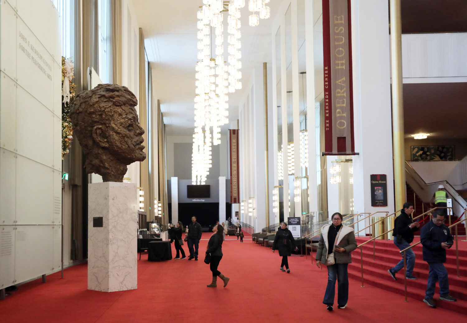 FILE - Visitors walk at the John F. Kennedy Memorial Center for the Performing Arts, Nov. 22, 2025,...