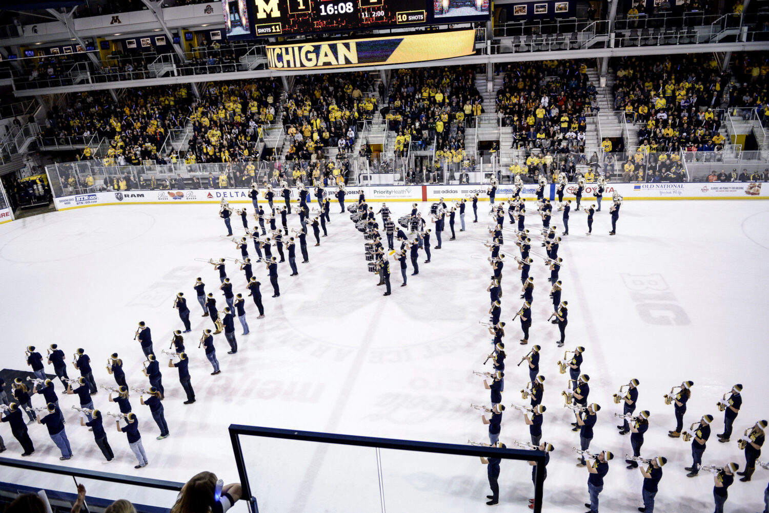 FILE - The Michigan Marching Band performs at the end of the first period during an NCAA college me...