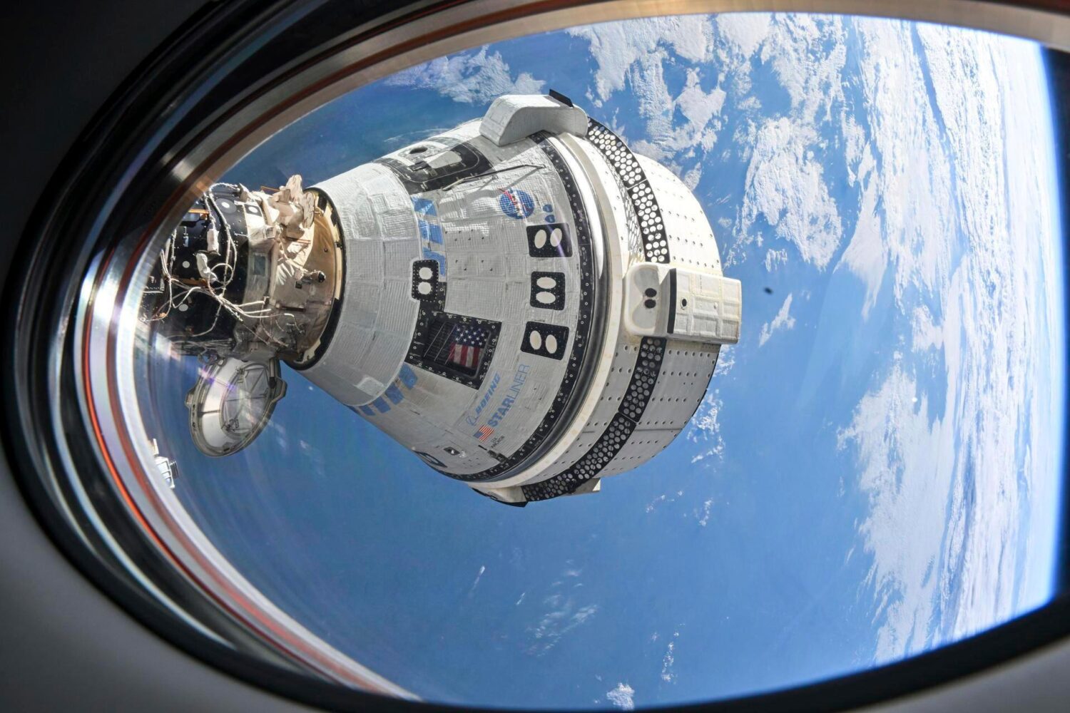 FILE - This photo provided by NASA shows Boeing's Starliner spacecraft docked to the International ...