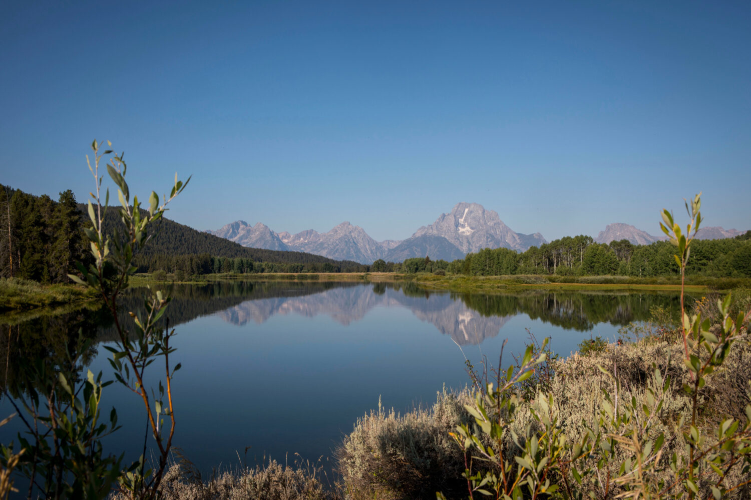 FILE - The Teton mountains reflect on Oxbow Bend in Grand Teton National Park in Moran, Wyo., Aug. ...