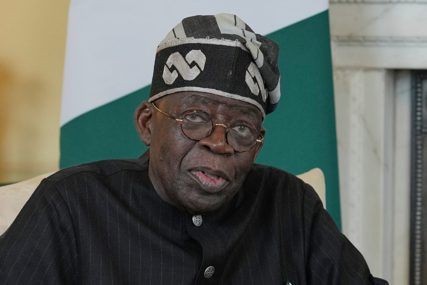 FILE -Nigerian President Bola Tinubu speaks to the media ahead of his meeting with Britain's Prime ...